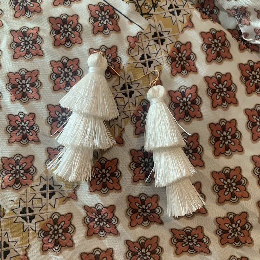 white tassel statement earrings